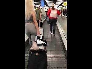 Following blonde's big booty while she pulls luggage Picture 3