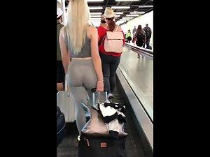 Following blonde's big booty while she pulls luggage Picture 7