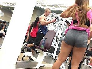 Hot teens flirting with bodybuilder in gym Picture 2