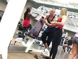 Hot teens flirting with bodybuilder in gym Picture 5