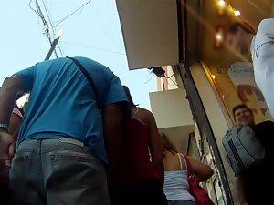 Upskirt of hairy girl while she is with protective boyfriend Picture 1