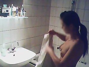 Sweet naked daughter in the bathroom