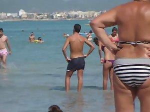 Tattooed hottie in a thong bikini Picture 8