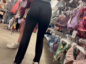 Crouching puts her tight buttocks and thong on display Picture 8