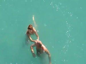 Horny couple in the water got caught Picture 2