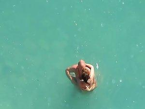 Horny couple in the water got caught Picture 4