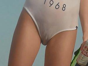Cameltoe in transparent swimsuit