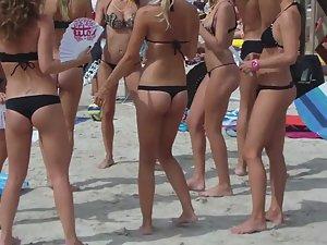 Club promoters dancing on beach Picture 6
