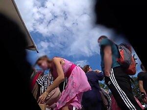 Upskirt under pink dress shows she isn't wearing panties Picture 7