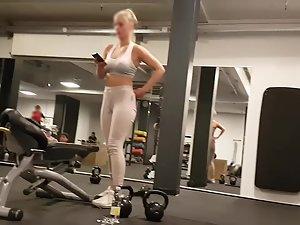 Lazy blonde is on the phone during her workout Picture 3