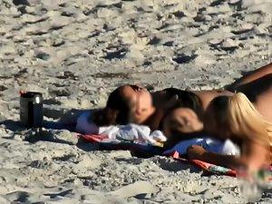 Hot blonde sunbathing next to butch lesbian friend Picture 1