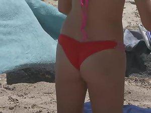 Hot teen in red thong bikini on beach with family Picture 1