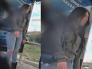 Curvy girl in torn jeans is smoking and waiting for the bus Picture 2
