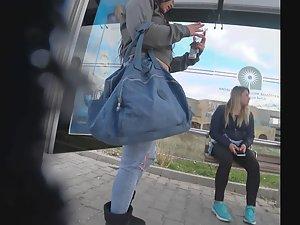 Curvy girl in torn jeans is smoking and waiting for the bus Picture 8