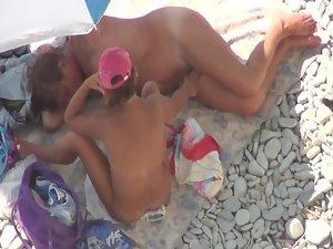 She yanks his dick while he lies down Picture 3