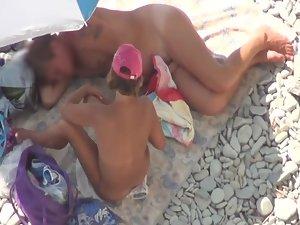 She yanks his dick while he lies down Picture 4