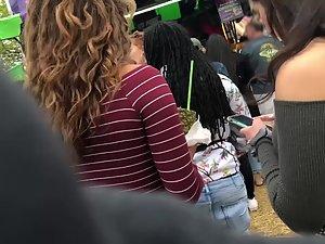 Curly haired girl with amazing ass in jeans Picture 1