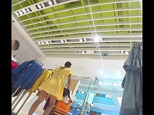 Upskirt of sultry milf in the clothes store Picture 3