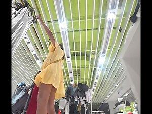 Upskirt of sultry milf in the clothes store Picture 8