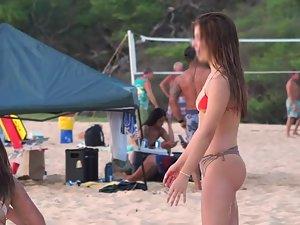 Playful teen girl does headstand on beach Picture 5
