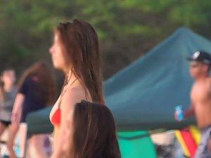 Playful teen girl does headstand on beach Picture 7