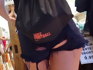 Inspecting a yummy ass in ripped shorts