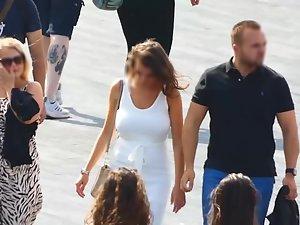 Busty tanned woman in tight white dress Picture 4