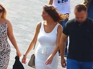 Busty tanned woman in tight white dress Picture 6