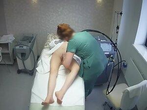 Sexy tattooed girl keeps texting during hair removal treatment Picture 1
