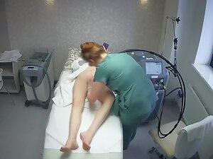 Sexy tattooed girl keeps texting during hair removal treatment Picture 2