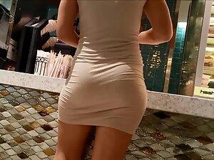 Tight dress shows the beauty of her curves