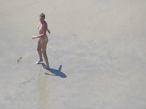 Wacky nudist woman rolls in the mud Picture 1