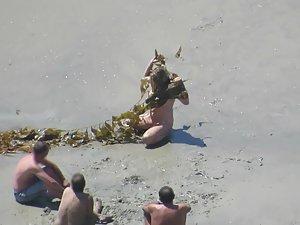 Wacky nudist woman rolls in the mud Picture 5