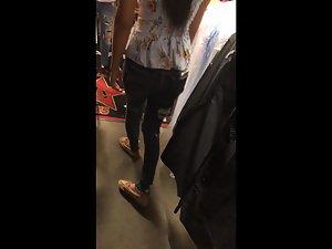 Cleavage of sexy store clerk in torn jeans Picture 4