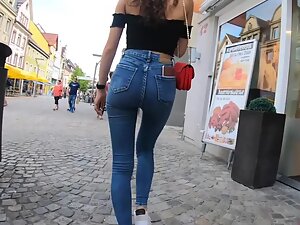 Curly girl looks sexy in tight jeans