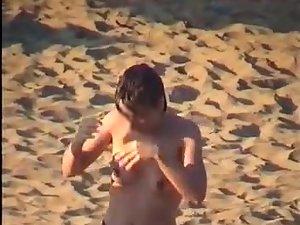 Nudist family leaving the beach Picture 2