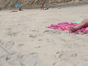Sexy nudist friends caught while sunbathing on beach Picture 2