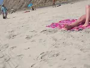 Sexy nudist friends caught while sunbathing on beach Picture 3