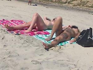 Sexy nudist friends caught while sunbathing on beach Picture 4