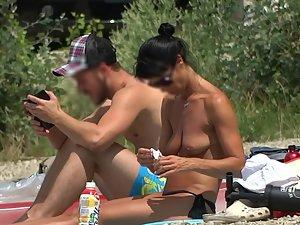 Topless milf with a much younger boyfriend at the beach Picture 5