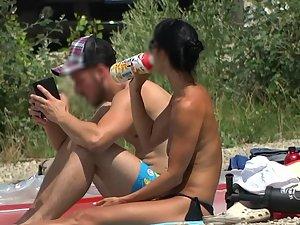 Topless milf with a much younger boyfriend at the beach Picture 6