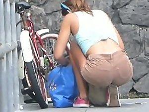 Hot firm ass of a girl unlocking a bicycle Picture 1
