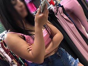 Nice tits of an excited girl in the clothes shop Picture 2