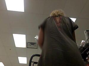 Upskirt of blonde milf in loose dress Picture 7