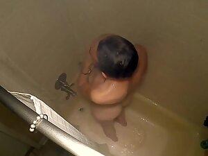 Spying on slim woman in shower from above Picture 1