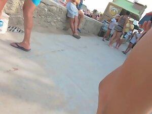 Two friends in thong bikinis walking by the beach Picture 3