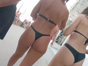 Two friends in thong bikinis walking by the beach Picture 8