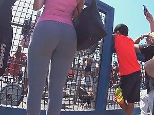 Splendid ass on display by the fence