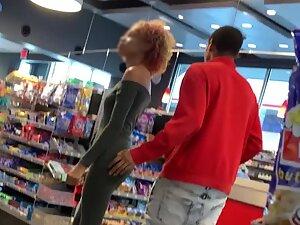 Slim black girl in store with boyfriend