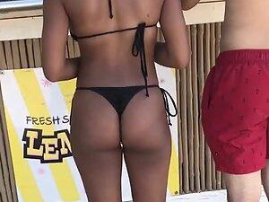 Closer look of fit black ass cheeks in string bikini